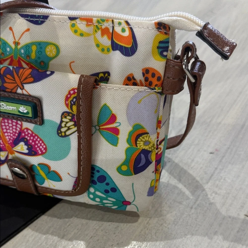 Lily Bloom Cream Crossbody Bag with Multicolor Butterfly Print and Brown Trim - Picture 2 of 12